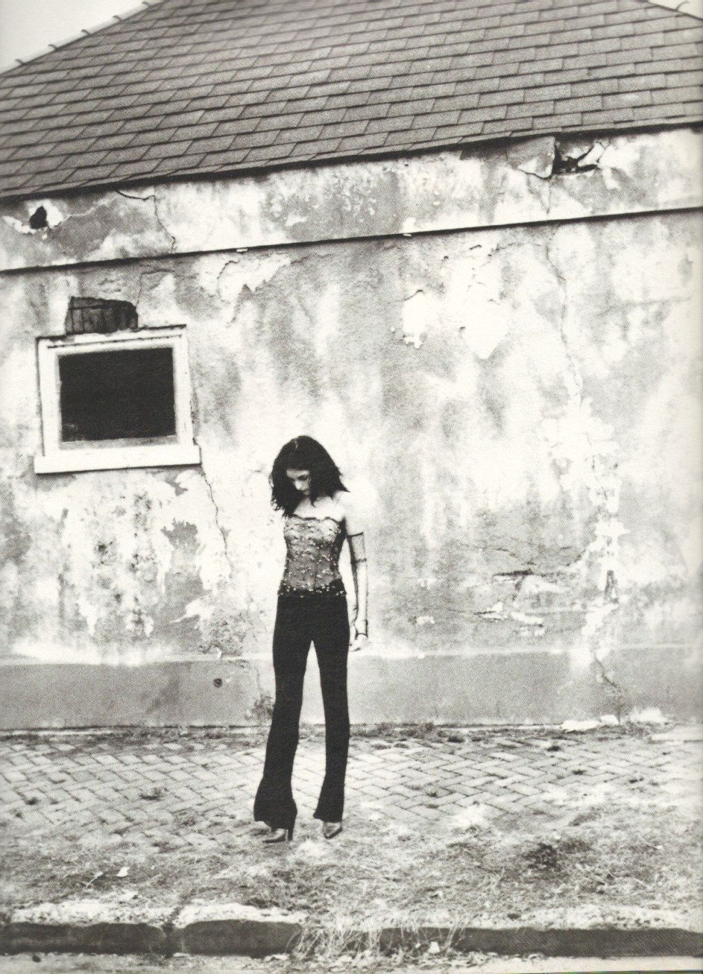 Jill Stuart's sequined sheer camisole; Karl Lagerfeld's black viscose pants. Krizia lace gloves; Prada leather pumps.