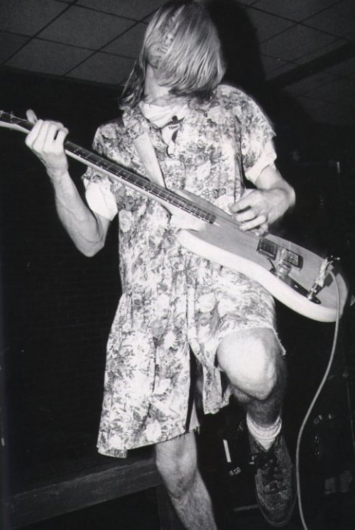 Kurt Cobain performs in a vintage floral print, Amherst, 1990