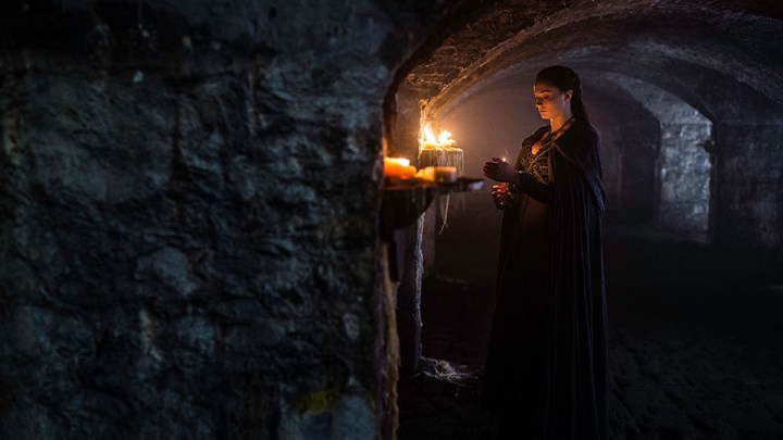 Sansa lights candles in the Stark crypt at Winterfell in "Sons of the Harpy" - Game of Thrones s5 e4