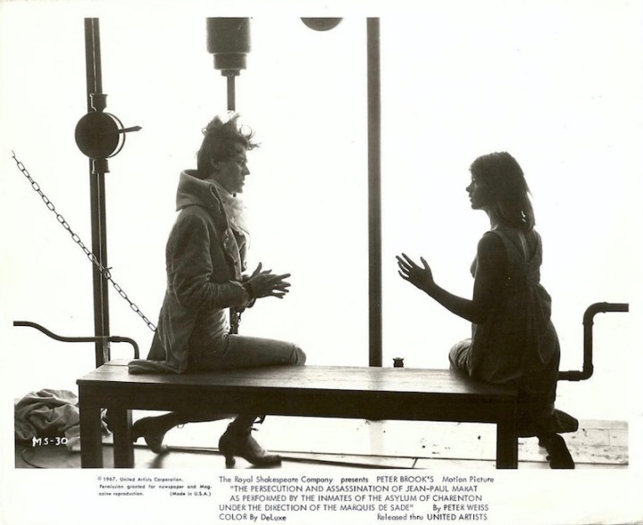 Black and white photo of John Steiner and Glenda Jackson as Monsieur Dupère and Charlotte Corday, with text, The Royal Shakespeare Company presents Peter Brook's motion picture "The Persectution and Assassination of Jean-Paul Marat as performed by the inmates of the asylum of Charenton under the direction of the Marquis de Sade, by Peter Weiss