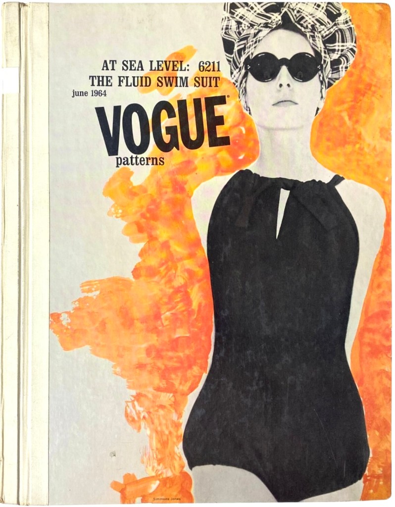 A model in sunglasses and a black, one-piece swimsuit made with Vogue pattern 6211 against an orange painted background on the cover of the Vogue Patterns retail catalogue for June 1964